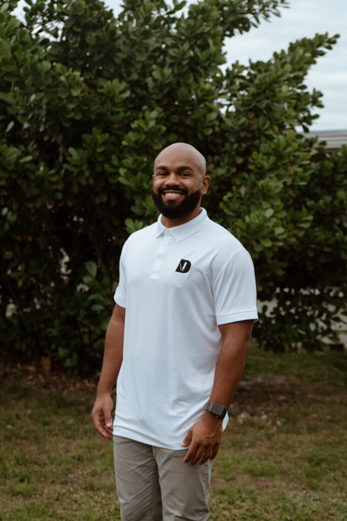 young man posing outdoors in Dickson Painters shirt